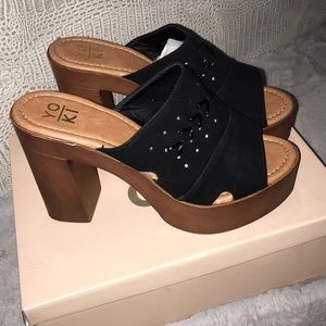 Black wedge slip on platform Yoki heels.